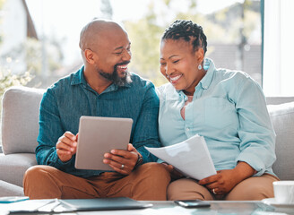 Were in this together. a mature couple using a digital tablet together.