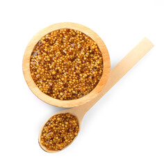 Bowl and spoon with whole grain mustard on white background