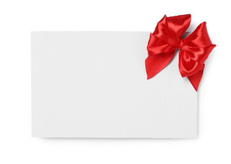 Blank gift card with red bow isolated on white, top view