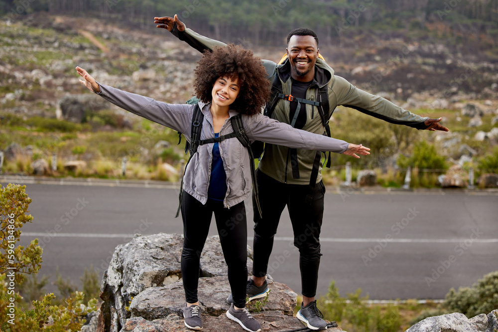 Poster feels like freedom. full length portrait of an affectionate young couple standing with their arms ou