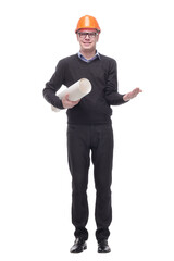 A view of a young construction worker wearing helmet and holding blueprints