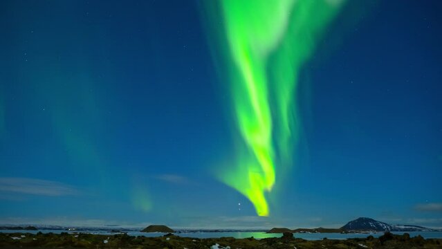 Aurora borealis. Northern lights in Iceland. Real night sky with stars in time lapse. 