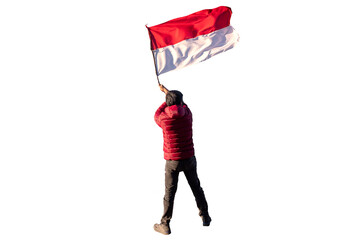 Adventurer man in red jacket waving indonesia flag