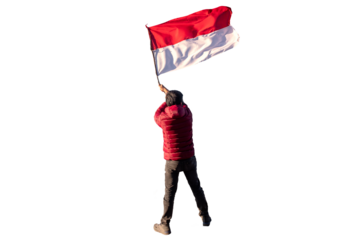 Adventurer man in red jacket waving indonesia flag