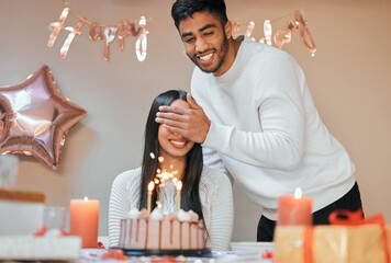 Are you ready for your big surprise. a young couple celebrating a birthday at home.