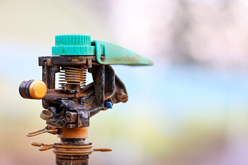 Close up view of old rusty sprinkler head