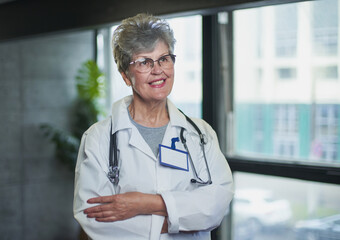 Senior female doctor smiling in hospital