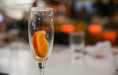Alcohol at the bar evokes luxury, celebration, and indulgence. Cocktails and champagne symbolize sophistication and socializing, but can also represent excess and addiction