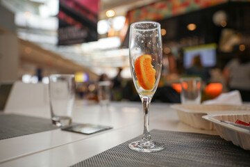 Alcohol at the bar evokes luxury, celebration, and indulgence. Cocktails and champagne symbolize sophistication and socializing, but can also represent excess and addiction