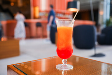 Alcohol at the bar evokes luxury, celebration, and indulgence. Cocktails and champagne symbolize sophistication and socializing, but can also represent excess and addiction