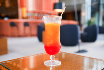 Alcohol at the bar evokes luxury, celebration, and indulgence. Cocktails and champagne symbolize sophistication and socializing, but can also represent excess and addiction