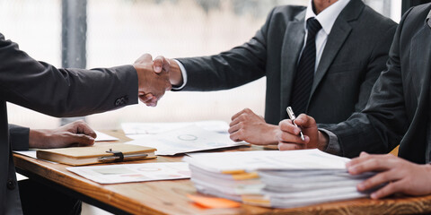 Business people handshake. Successful businessmen handshaking after good deal. Finishing up meeting concept