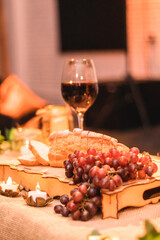 Communion Decoration for easter and passover with glass of wine grapes and Unleavened Bread