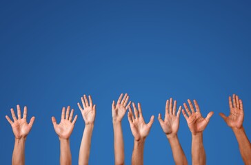 International human group hands on blue background