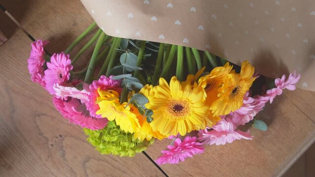 Flower arrangement of gerbera transvaal daisies from the top in slow motion 4K