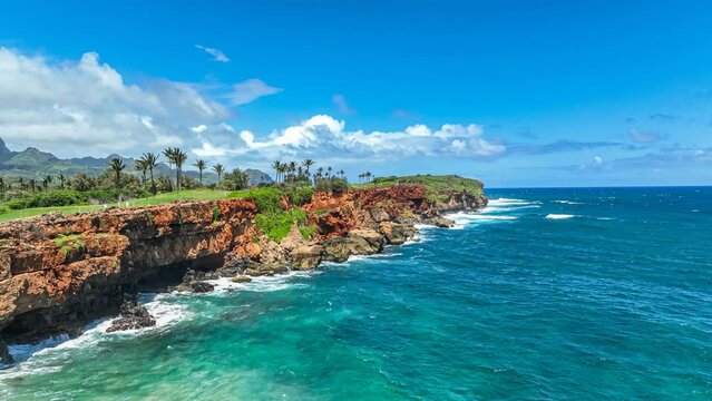 Flying over Hawaiian coastline to an aerial view of a scenic golf course