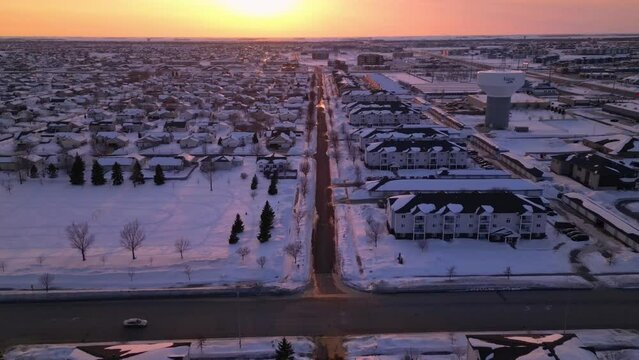 neighborhood in Fargo, North Dakota. houses and water tower. snow and winter in the city