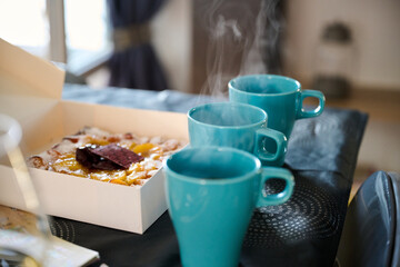 three cups of coffee and cake