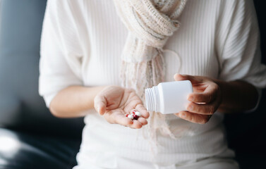 pills in a Senior's hands. Painful old age. Caring for the health of the elderly