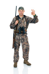 Full lengt portrait of serious duck hunter with a rifle and binoculars show ok okay gesture, isolated on white background. Fifty-year-old man in hunting uniform standing in studio.