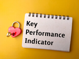 Red love padlock and notebook with the word Key Performance Indicator