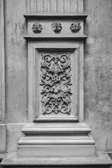 Intricate ornamentation, ornate, pillars, arches and neoclassical architecture on walls of abandoned palace: a journey through art and time (in black and white)