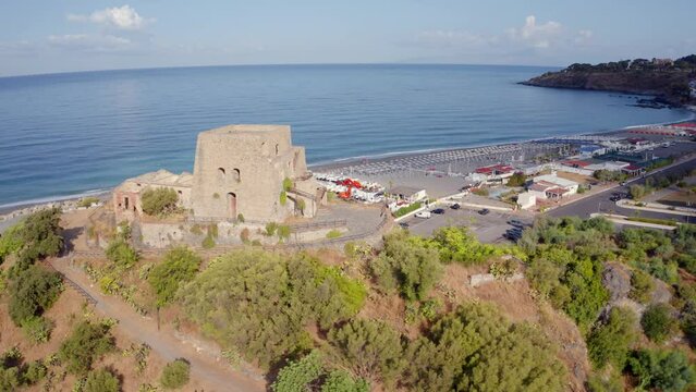 4k drone flight moving to the side footage (Ultra High Definition) of historical place - Talao Tower. Spectacular cityscape of Scalea town, Province of Cosenza, Italy. Vacation concept background.