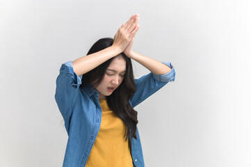 Portrait photo of funny Asian woman in colorful clothing posing begging, asking or making a wish on...
