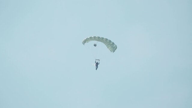 Jakarta, Indonesia - April 9, 2023: Parachuting action by the Indonesian Air Force at Halim Perdana Kusuma Airport