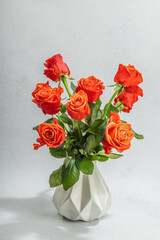 Bouquet of fresh bright roses on vase. Romantic gift concept, greeting card. Valentines, Woman's Day