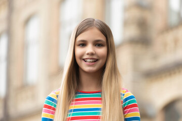 portrait of smiling teen girl outdoor. portrait photo of teen girl outside. portrait of teen girl.