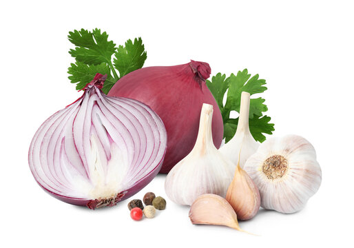Red onions, coriander, mixed peppercorns, garlic bulbs and cloves on white background