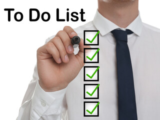 To Do List. Man ticking check boxes with marker on glass board against white background, closeup