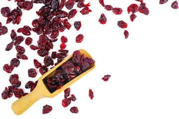 Some dried cranberry in wooden scoop isolated on white background