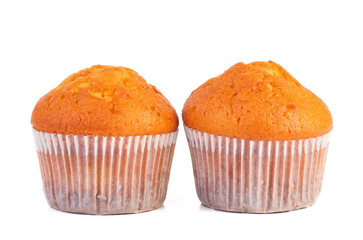 Two homemade muffins isolated on a white background