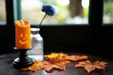 Halloween decorations background. Halloween with candle on wooden table Halloween holiday concept.
