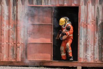 Fototapeta na wymiar The firefighter gently scoops up the child in their arms making sure they are safe and secure.