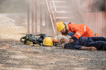 The firefighters acted quickly to save the victims who were lying on the floor choking on water,...