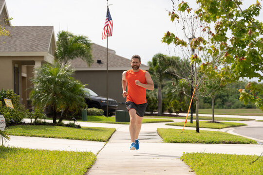 smiling sport runner run outdoor. sport runner having run workout. photo of sport runner run.