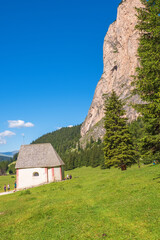 Small chapel on an alp meadow at a rock wall in Langental in Italy