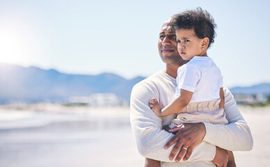 Father, holding boy and mockup space at beach with bond, care or love in summer sunshine on holiday. Man, male baby and hug with thinking, vision and family with support, sea vacation and mock up © Azeemud-Deen Jacobs/peopleimages.com
