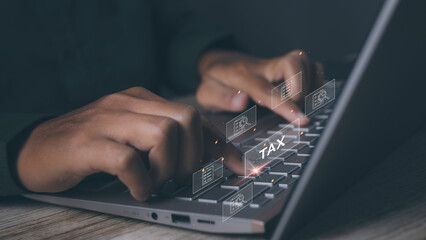 Businessman using computer to complete Individual income tax return form online