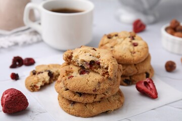 Cookies with freeze dried fruits and nuts on white marble table, closeup