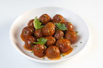 Meatballs served with tomato sauce in frying pan
