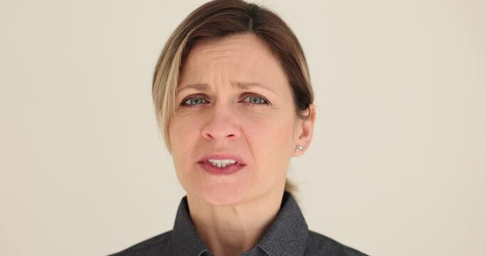 Portrait of joyless nervous upset woman. Female emotions stress and depression