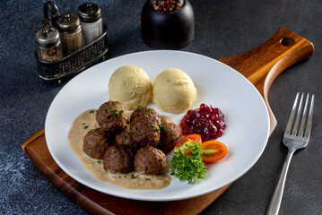 Swedish meatballs with creamy gravy, mashed potatoes and lingonberry sauce.