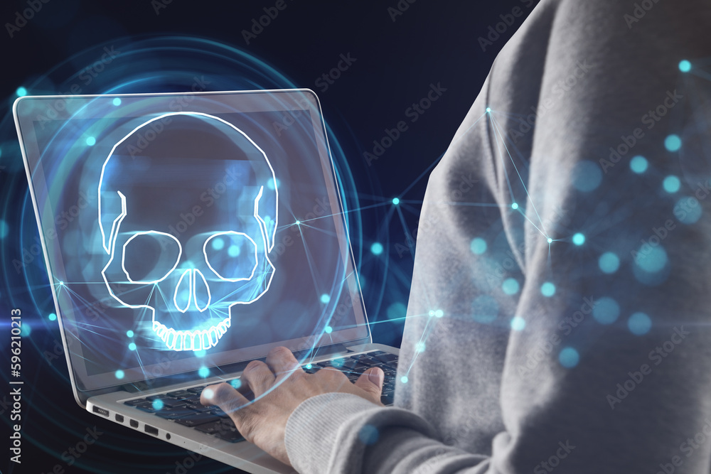 Poster hacker using laptop with digital blue skull hologram on dark background. ransomeware, virus and pira