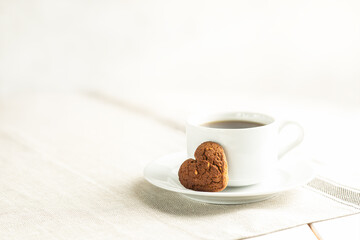 White cup of tea and cookies.
Testy Breakfast