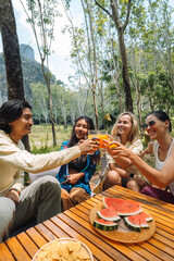4 friends having a summer party in the nature, happy joyful moment