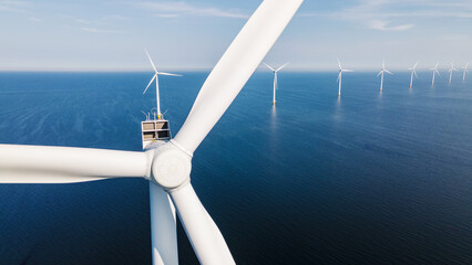  windmill park with a blue sky on a sunny day in the Netherlands, biggest windmill park in the ocean